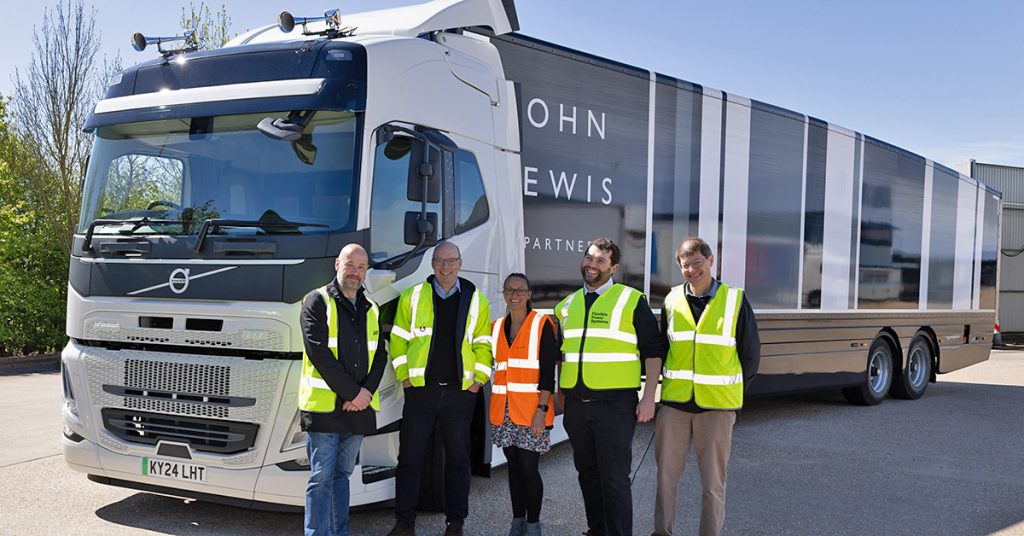 JOLT members standing next to a Volvo eHGV